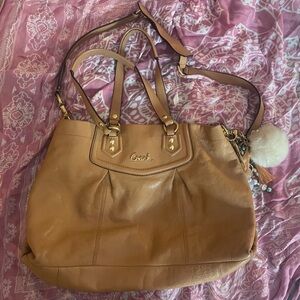 Beautiful beige Coach leather bag with lilac interior. Excellent used condition!